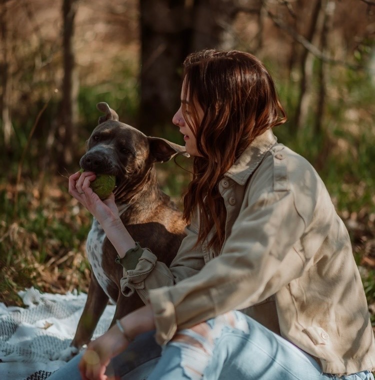 Faith with a happy dog in the park